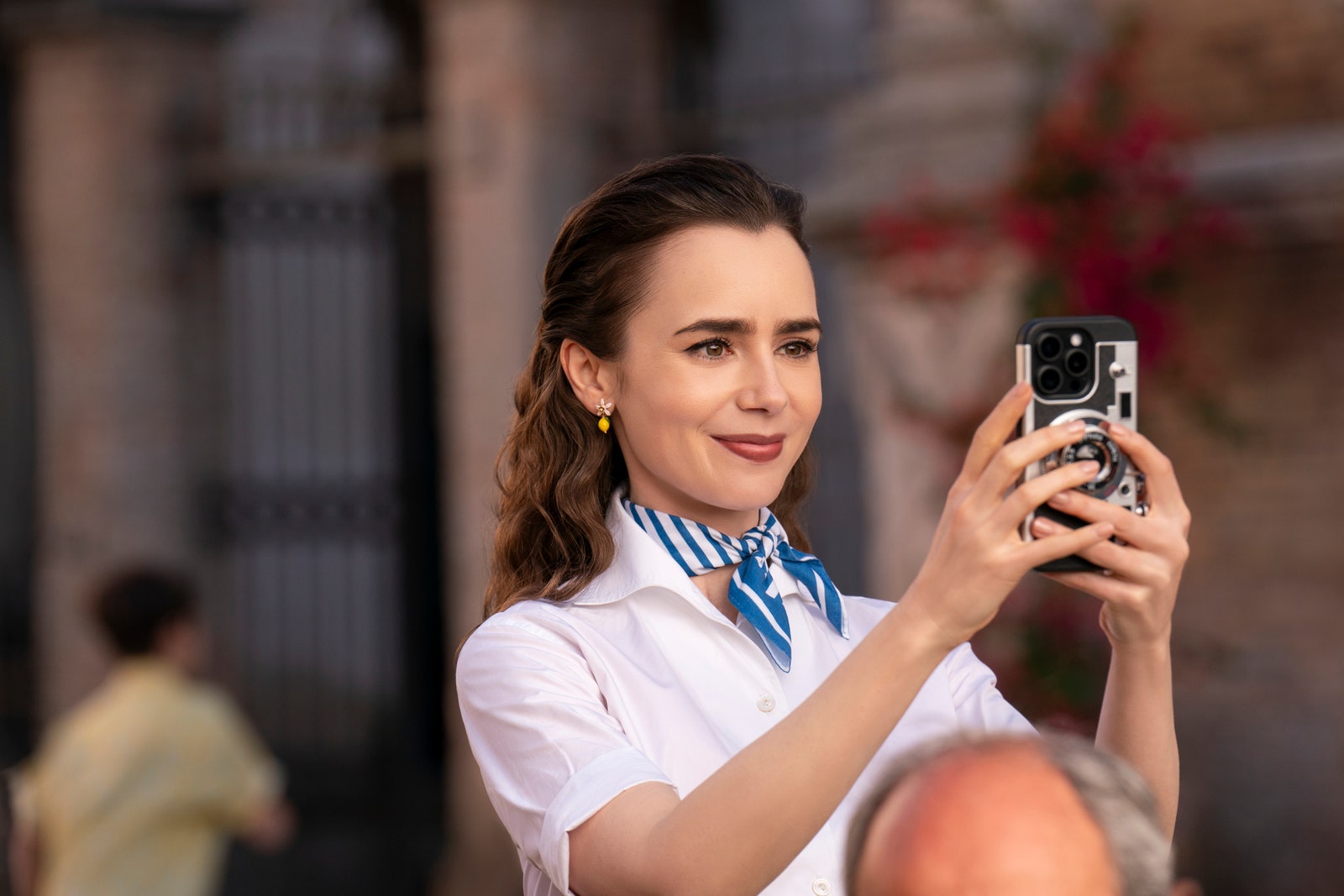 Image may contain Lily Collins Photography Camera Electronics Face Happy Head Person Smile Adult and Teen