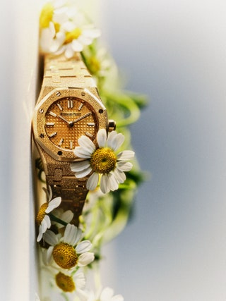 Image may contain Wristwatch Arm Body Part Person Daisy Flower and Plant