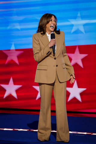 Image may contain Kamala Harris Crowd Person Clothing Coat Adult Audience Face Head Formal Wear Happy and Speech