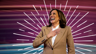 Image may contain Kamala Harris Head Person Face Happy Laughing Adult Smile Sword Weapon Clothing and Coat